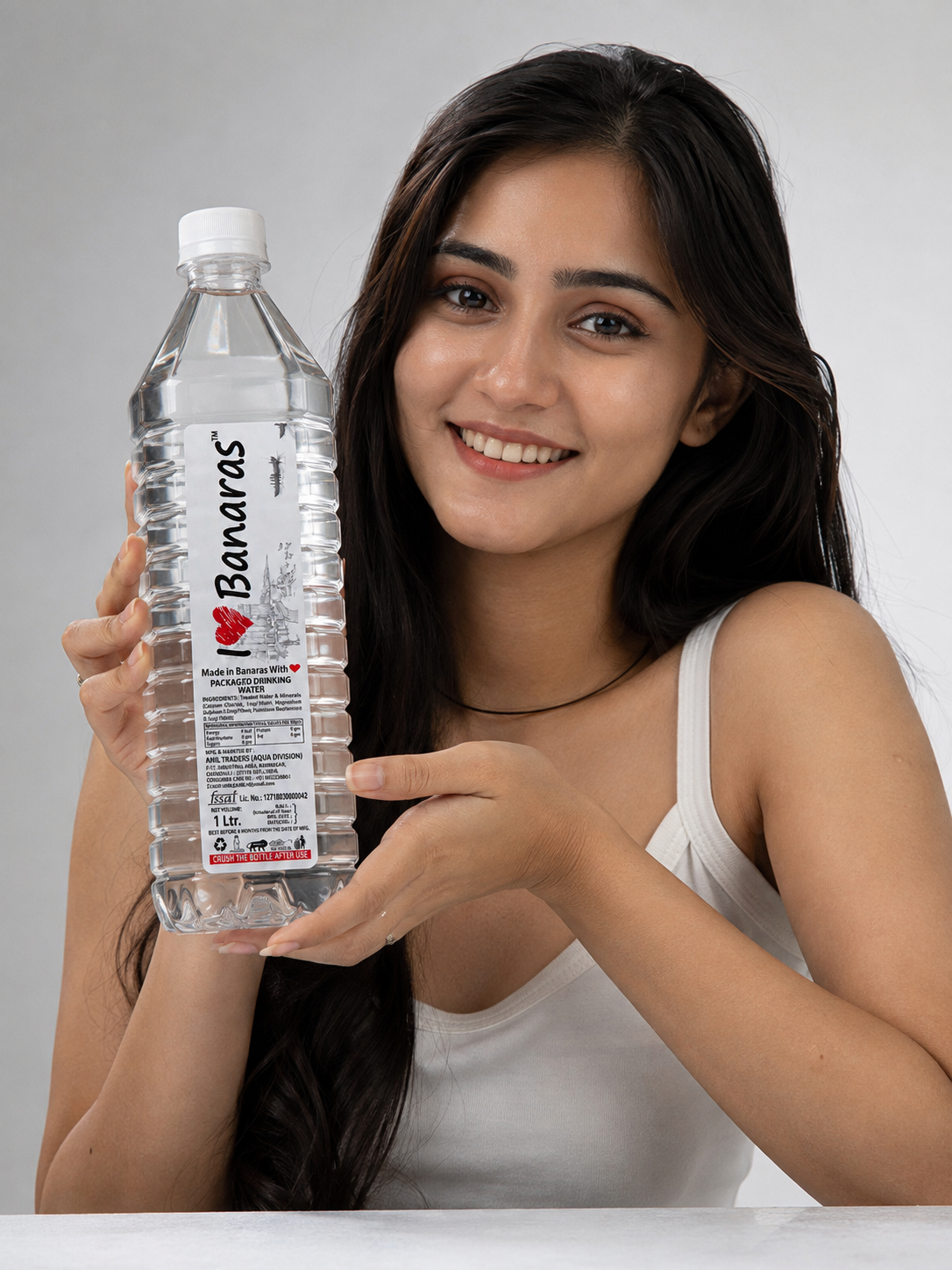 Model holding an I Love Banaras 1 litre bottle